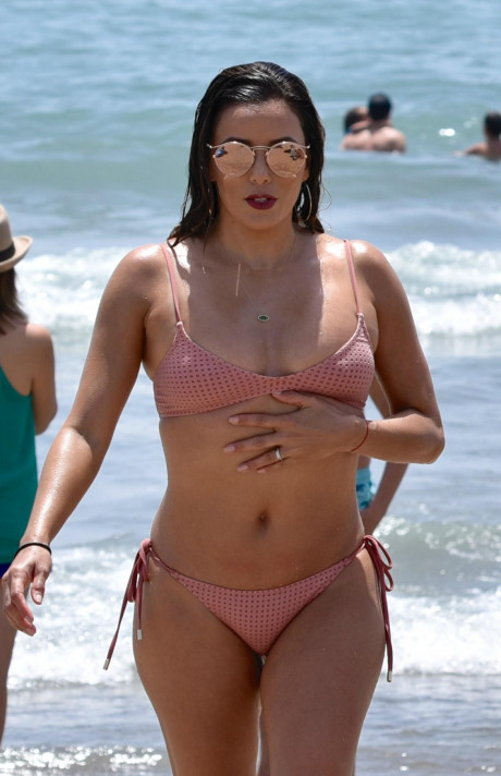 Eva Longoria Shows Off Her Pert Bum And Slender Frame As She Hits The Beach In A Pink On